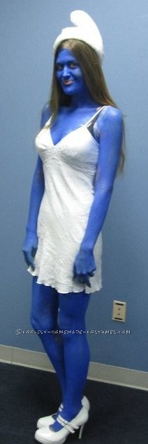 I used body paint ofcourse and my husbands help...this was for my company Halloween Party 2010. I took a simple white dress a few cotton balls- hot g