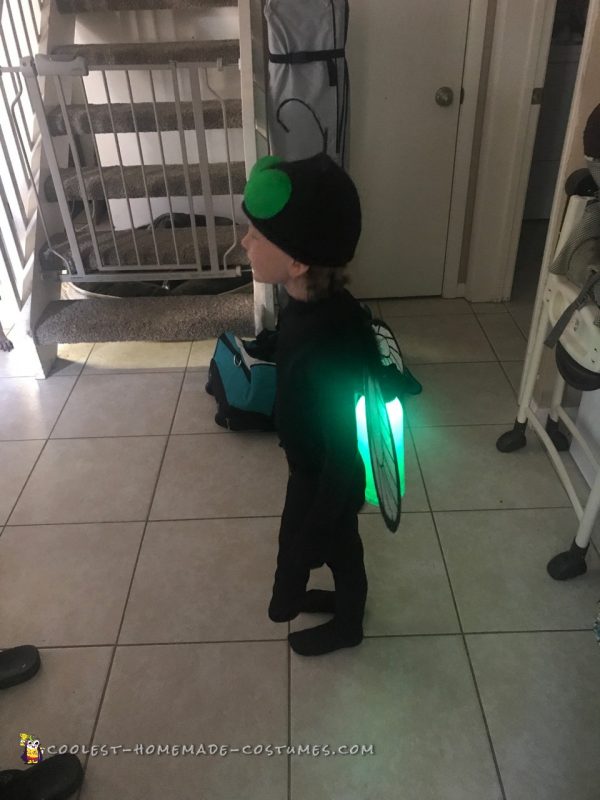 Little Girl Catching Lightning Bugs in a Jar