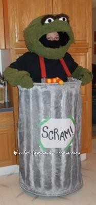 I spotted the perfect Oscar the grouch color blanket and set about making a costume. The head was made out of duct tape and wire, then I glue gunned