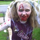 This costume is completely homemade by me. My daughter decided as a joke she wanted to be a zombie cheerleader. Well, trying to find a costume was im