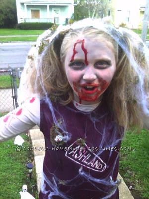 This costume is completely homemade by me. My daughter decided as a joke she wanted to be a zombie cheerleader. Well, trying to find a costume was im