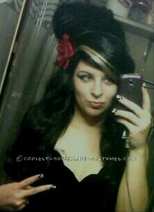 Home made black velvet dress :) an awesome handmade wig, red  flower glued to a hair clip, eyeliner, printable tattoos  and fake lip pierci