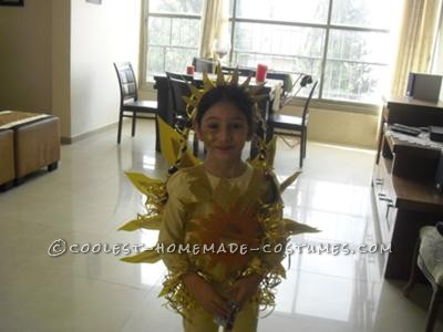 My very creative daughter decided she wants to be a sun for Purim. The internet offered boring/expensive options.  Well, with some arts and craf