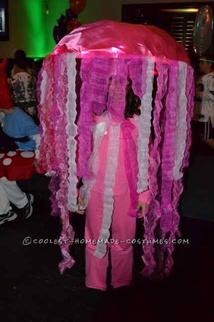 Jellyfish Costume
 
My daughter wanted to be a Jellyfish for Halloween.
 
We used an old bike helmet to keep the jellyfish on her head.