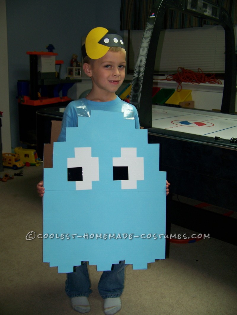 My son wanted to be a light blue Pac Man ghost for Halloween. I took a large piece of cardboard and cut it to shape (I looked at images online to fig