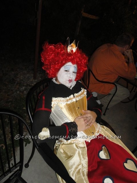 Materials used: Gold and Red curtains, Gold/White corset, Black button-up, short-sleeve dress, Black thigh-highs with lace, Red ribbon, elastic, crin