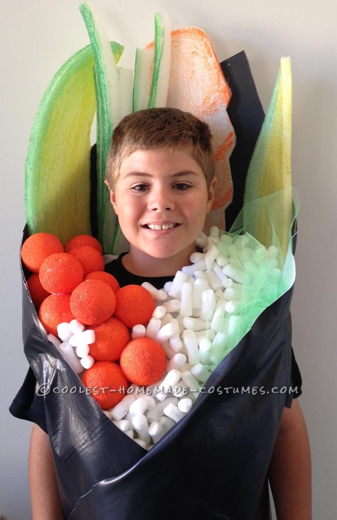 Here's what I used:  White felt
Black Vinyl Fabric
Black poster board
Packing foam
Styrofoam balls
Green Tulle
White packing peanuts
Some m