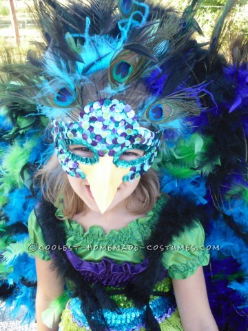 This costume was a labor of love.  My lovely daughter Mitrian decided she wanted to be a peacock with a giant tail with real feathers.  She