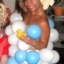 This costume was such a big hit!  I blew up blue and white balloons and safety pinned them to a flesh colored tank top and shorts.  The onl