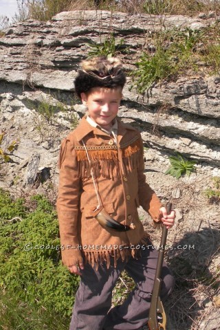 Here is my son in his Davy Crockett AKA Daniel Boone costume created by his grandmother.  She used a faux suede fabric for jacket with coor