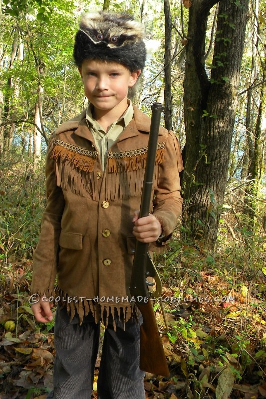 Here is my son in his Davy Crockett AKA Daniel Boone costume created by his grandmother.  She used a faux suede fabric for jacket with coor