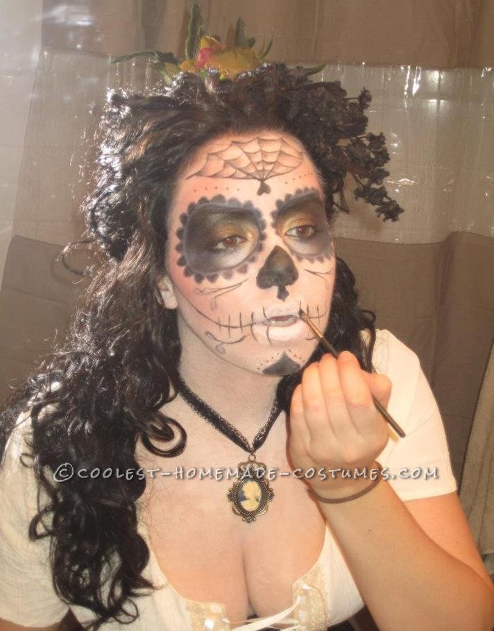 I started off wanting to incorporate the popular Dia de los Muertos skull candy makeup into a halloween costume.  I was inspired by photos I fou