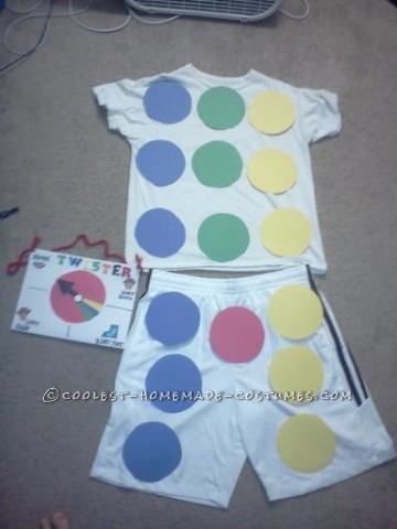 Buy a white t-shirt and white shorts or pants. This costume requires 4-10 pieces of construction paper of 4 different colors (to make the circles) an