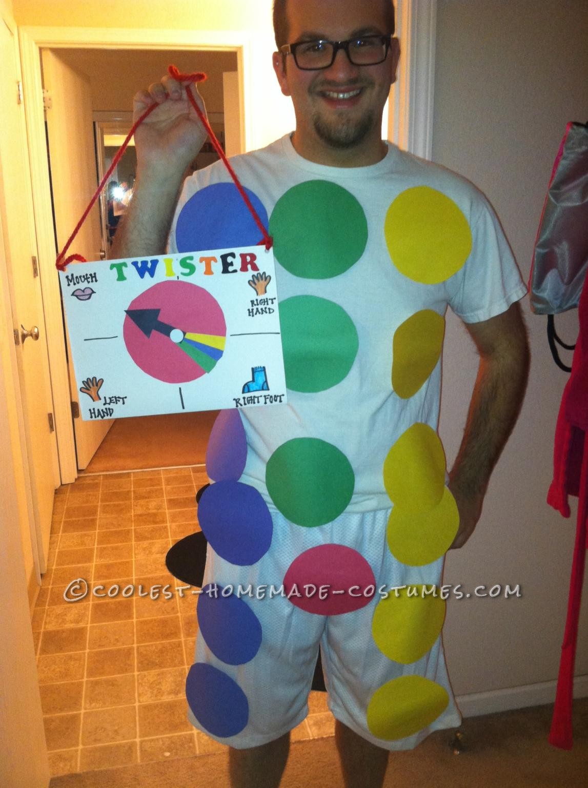 Buy a white t-shirt and white shorts or pants. This costume requires 4-10 pieces of construction paper of 4 different colors (to make the circles) an