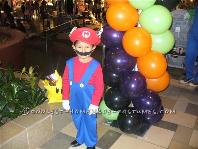 Made the hat from felt and the overalls from blue nylon material. It was not too difficult and it was a halloween when mario was not as popular. We p