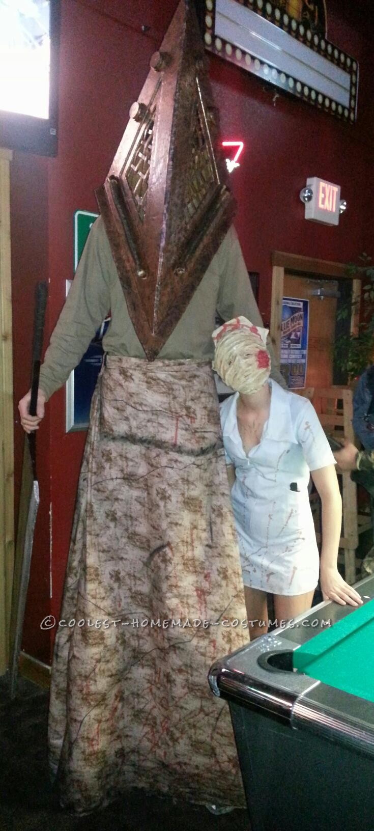 We are the Pyramid Head and bobblehead nurse from the movie silent hill. with the 3D movie just coming out it was perfect for us to dress up as them!