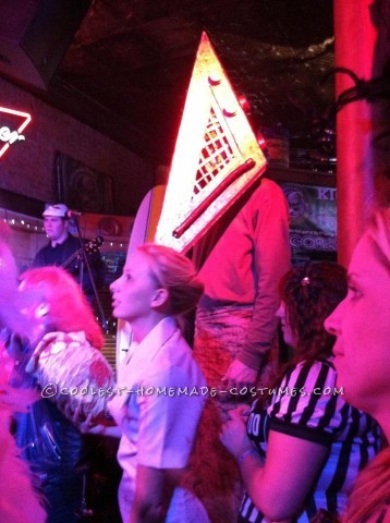 We are the Pyramid Head and bobblehead nurse from the movie silent hill. with the 3D movie just coming out it was perfect for us to dress up as them!