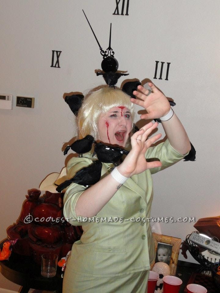 I went as Tipi Hedron from \"The Birds.\"
In order to make this look, I first found a green dress/jacket at Savers that was hemmed to give it a