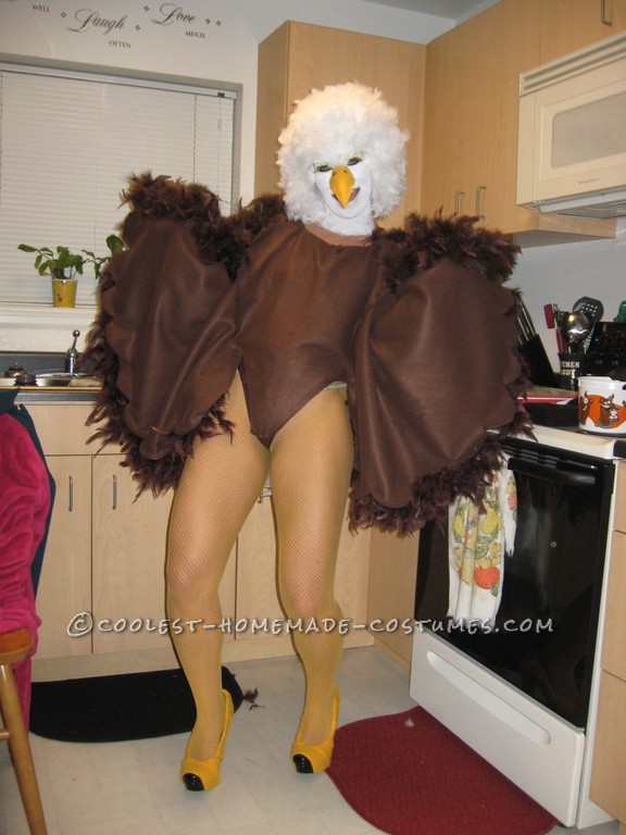 I used several materials. I first got a brown leotard and hot glued on brown feather boas to the back side of the leotard. Then using Fleece fabric a