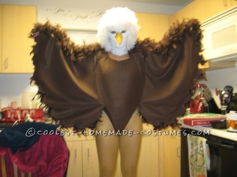 I used several materials. I first got a brown leotard and hot glued on brown feather boas to the back side of the leotard. Then using Fleece fabric a