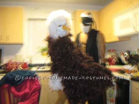 I used several materials. I first got a brown leotard and hot glued on brown feather boas to the back side of the leotard. Then using Fleece fabric a