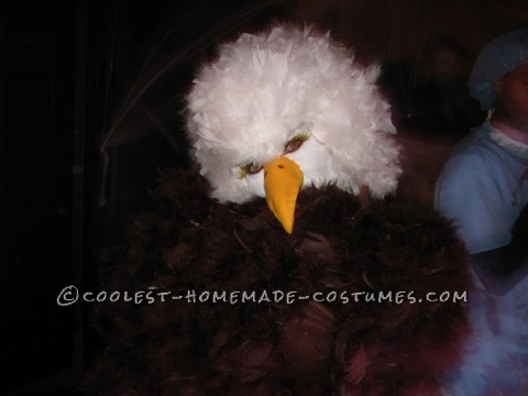 I used several materials. I first got a brown leotard and hot glued on brown feather boas to the back side of the leotard. Then using Fleece fabric a