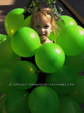 Got Grapes?
 
This is Ms. Audrey Lee. Her “bunch -o -grapes” costume was created simply (and afford -ably) with green balloons, a