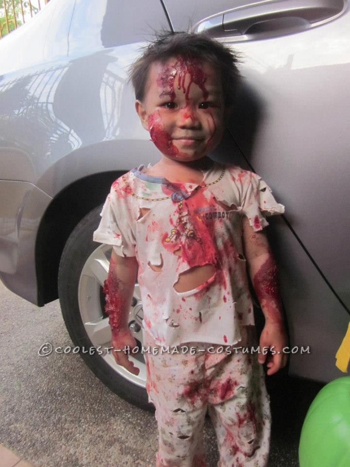 My son, Elijah Seraphiel Basanal, 2yrs old, is wearing bloody zombie costume. I\'ve researched the ideas online on how to do fake wounds and