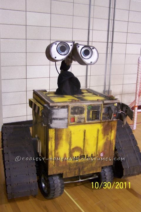 Coolest Homemade Driving Built-to-Scale Wall-E Halloween Costume: Our R2D2 was such a hit the previous year that my husband decided to make a full size, to scale Wall-E from the movie. He drew out the plans and made