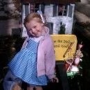 Emilia, age 2 choose Dorothy from the Wizard of Oz as her Halloween costume.  Pulling her in a wagon was the perfect set up for her house prop.&