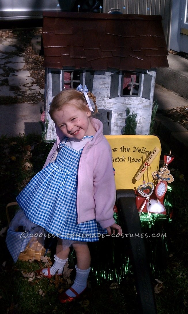 Emilia, age 2 choose Dorothy from the Wizard of Oz as her Halloween costume.  Pulling her in a wagon was the perfect set up for her house prop.&