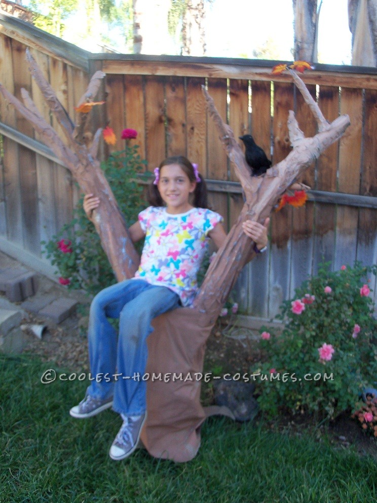 Original Girl in a Tree Illusion Costume: My ten year old daughter came up with this idea and built just about all of this costume by herself. She won the grand prize at her school's trunk-a-t