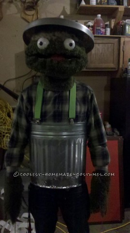 Fun Homemade Oscar the Grouch Halloween Costume: I got most of my materials for Oscar the Grouch costume at Wallmart! The green fur is made out of green bath rugs. I had an old wire hanging flower p