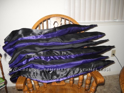 Coolest Homemade Ursula the Sea Witch Costume: I started with a bustier and a crinkle skirt. I bought a ton of black mesh, and made a tutu by tying cut strips to elastic. This sat under the tentacl