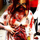 Grotesque Zombie Costume with Bloody Stomach and a Zipper Face