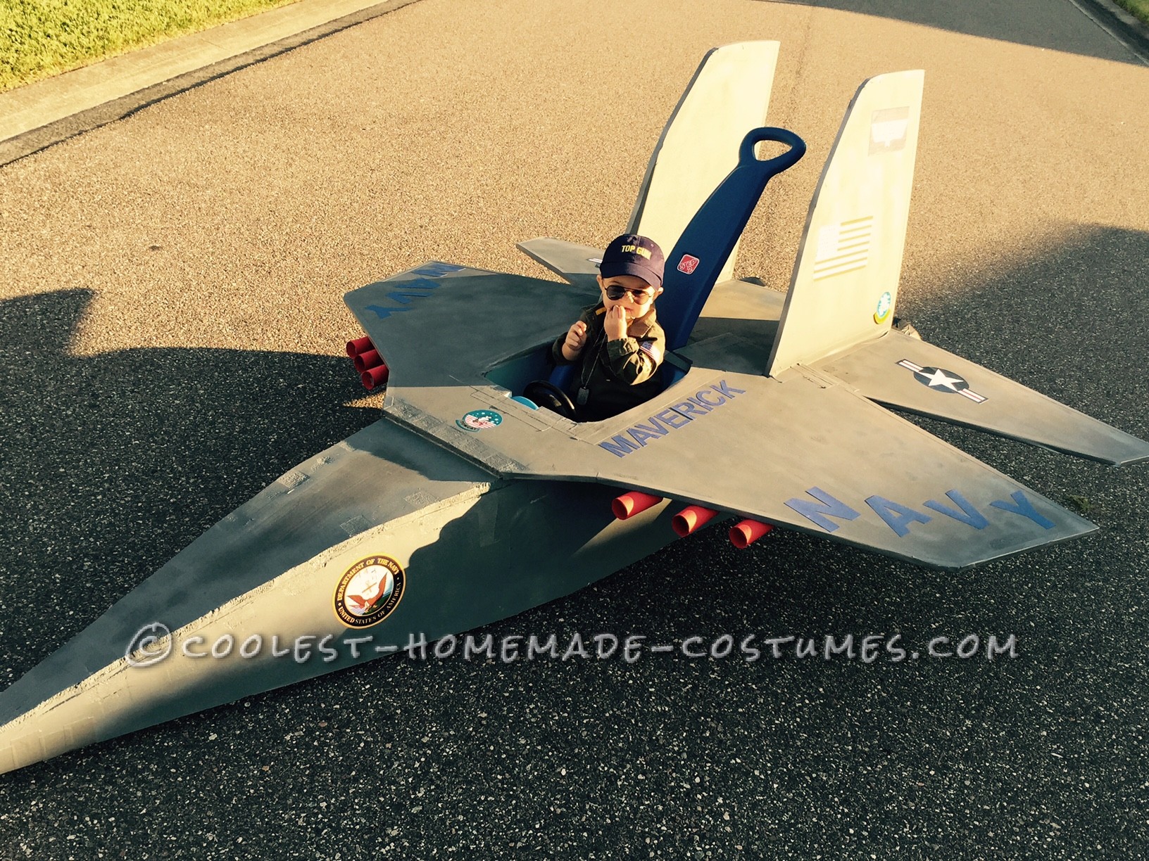 Top Gun Baby Pilot Costume with an F-14 Tomcat Jet Plane
