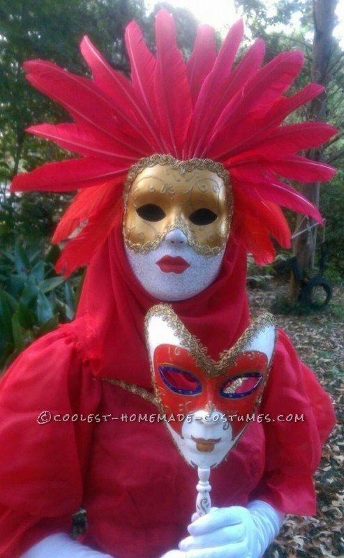 a close up of both the female masks. 