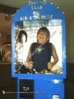 Homemade Kid in a Claw Machine Halloween Costume Idea